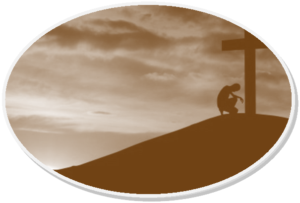 Silhouette of man kneeling before a cross