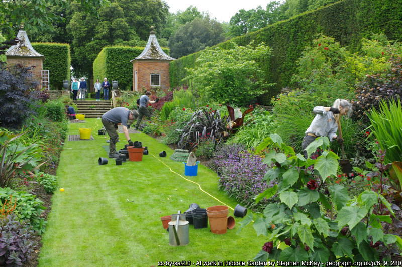 Gradeners working on flower border at Hidcote